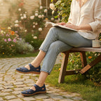 Woman wearing Navy Blue comfort sandals while relaxing outside on a bench