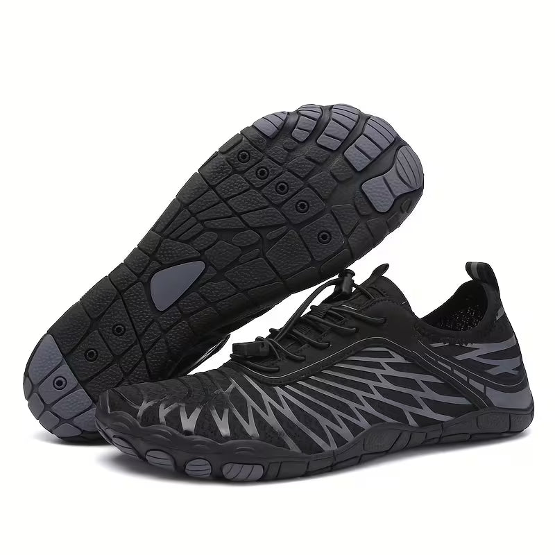 Angled pair of black  Nomad barefoot shoes highlighting the lightweight construction and flexible outsole.