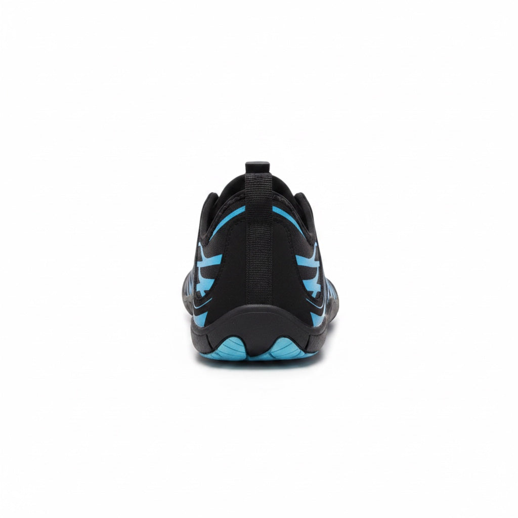 Rear view of the black and blue Nomad barefoot shoe showing the heel structure and blue outsole details