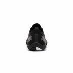Rear view of the black Nomad barefoot shoe showing the heel structure and flexible outsole.