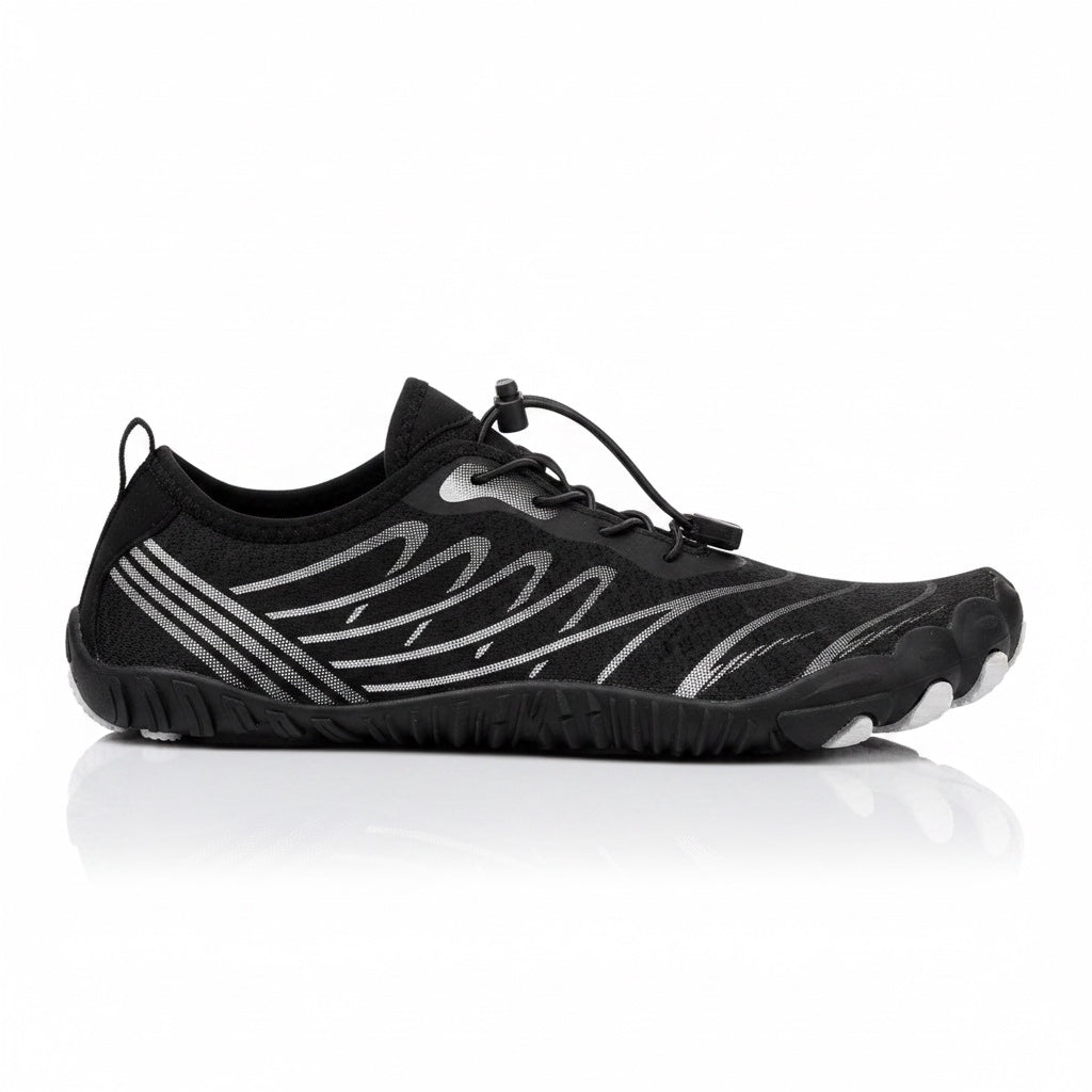 Black Nomad barefoot shoe shown from the side, highlighting its lightweight upper and minimalist construction.