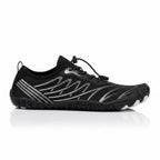 Black Nomad barefoot shoe shown from the side, highlighting its lightweight upper and minimalist construction.