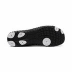 Bottom view of the black  Nomad barefoot shoe showing the textured outsole designed for flexibility and grip.