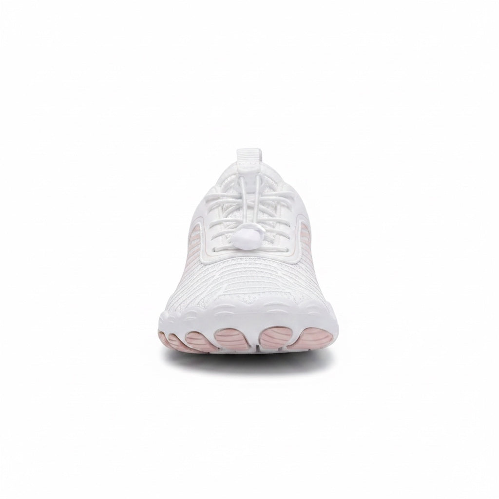 Front view of the white Nomad barefoot shoe showing the wide toe area and natural foot shaped design.