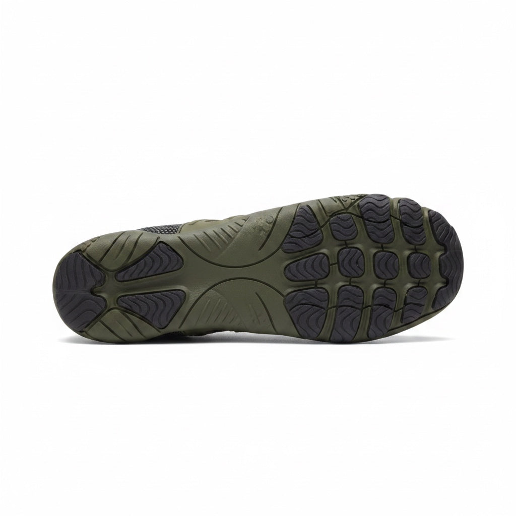 Bottom view of an olive green barefoot shoe showing its textured traction sole