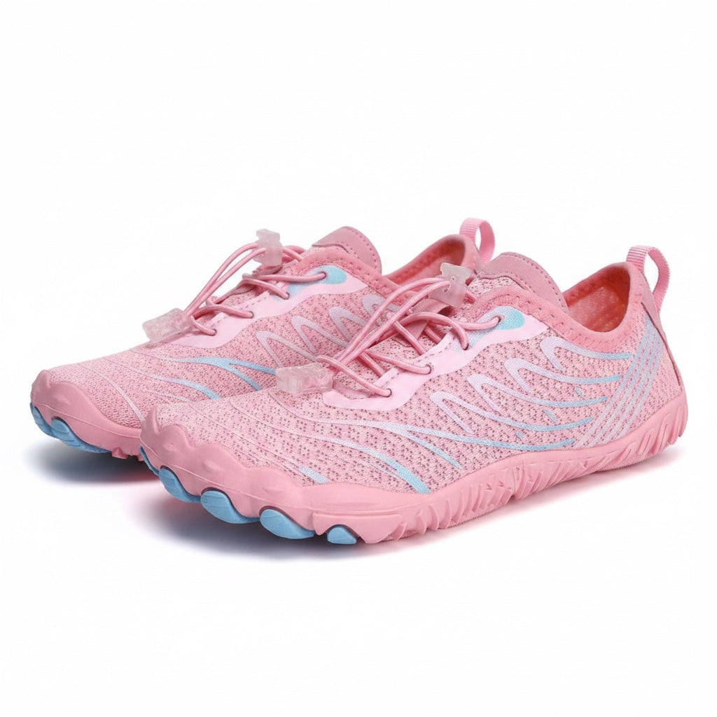 Angled view of the pink barefoot shoes highlighting their breathable upper and flexible sole.