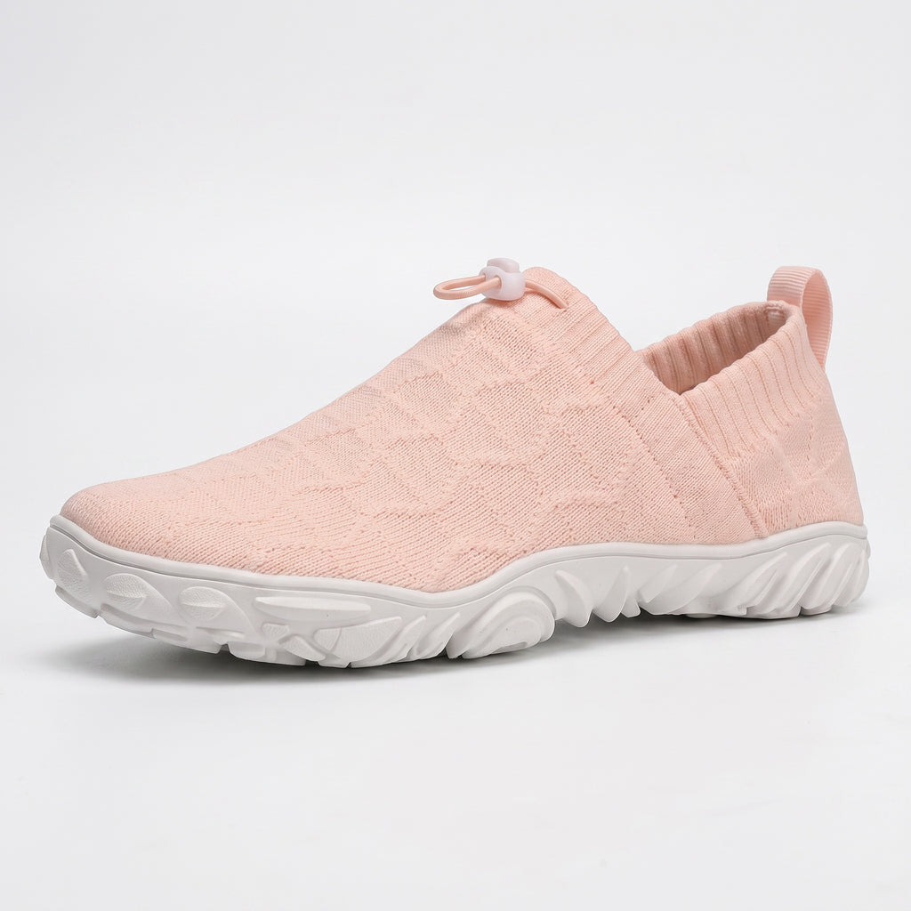 Pink Mens Aura slip on barefoot shoes with a white sole. These barefoot shoes are lightweight and wide toe for natural movement.