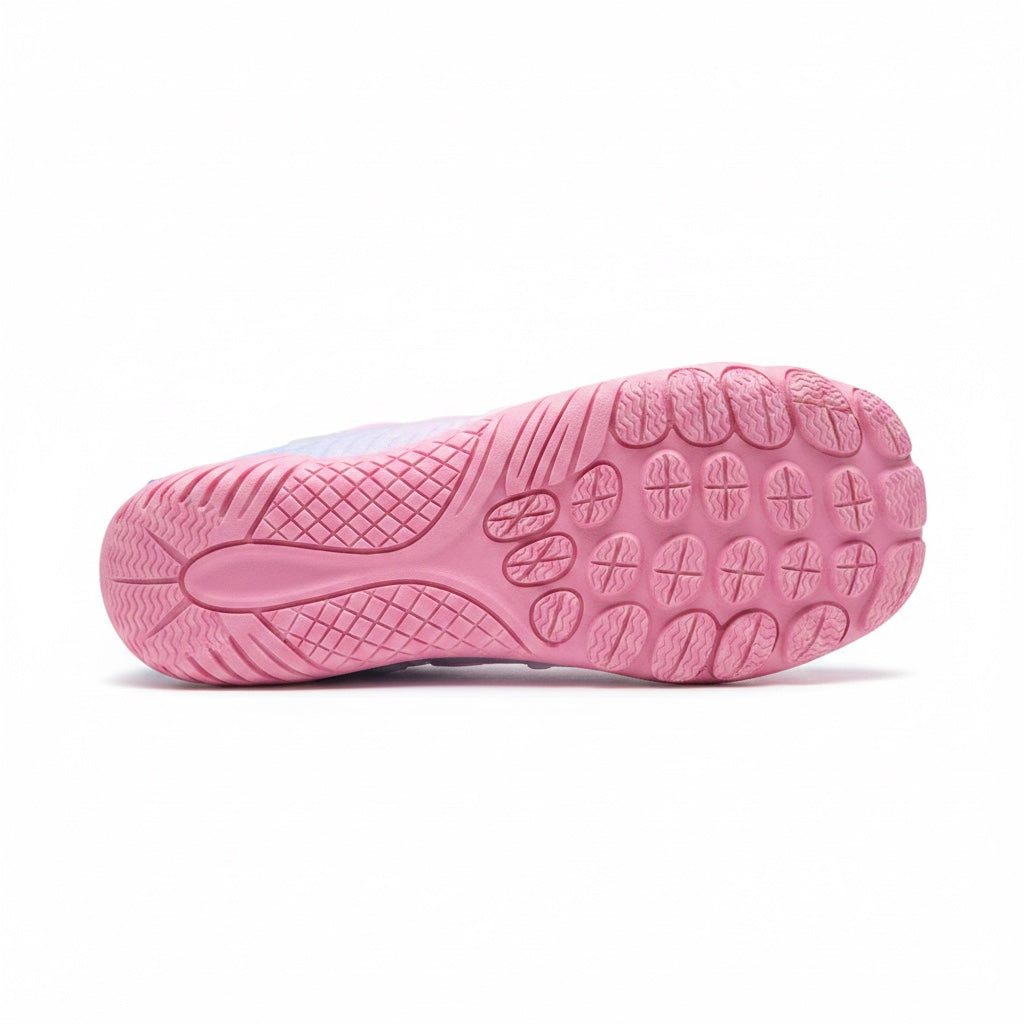 Bottom view of a pink barefoot water shoe showing its textured rubber sole