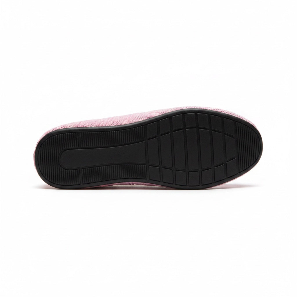 Bottom view of pink water shoe with textured sole