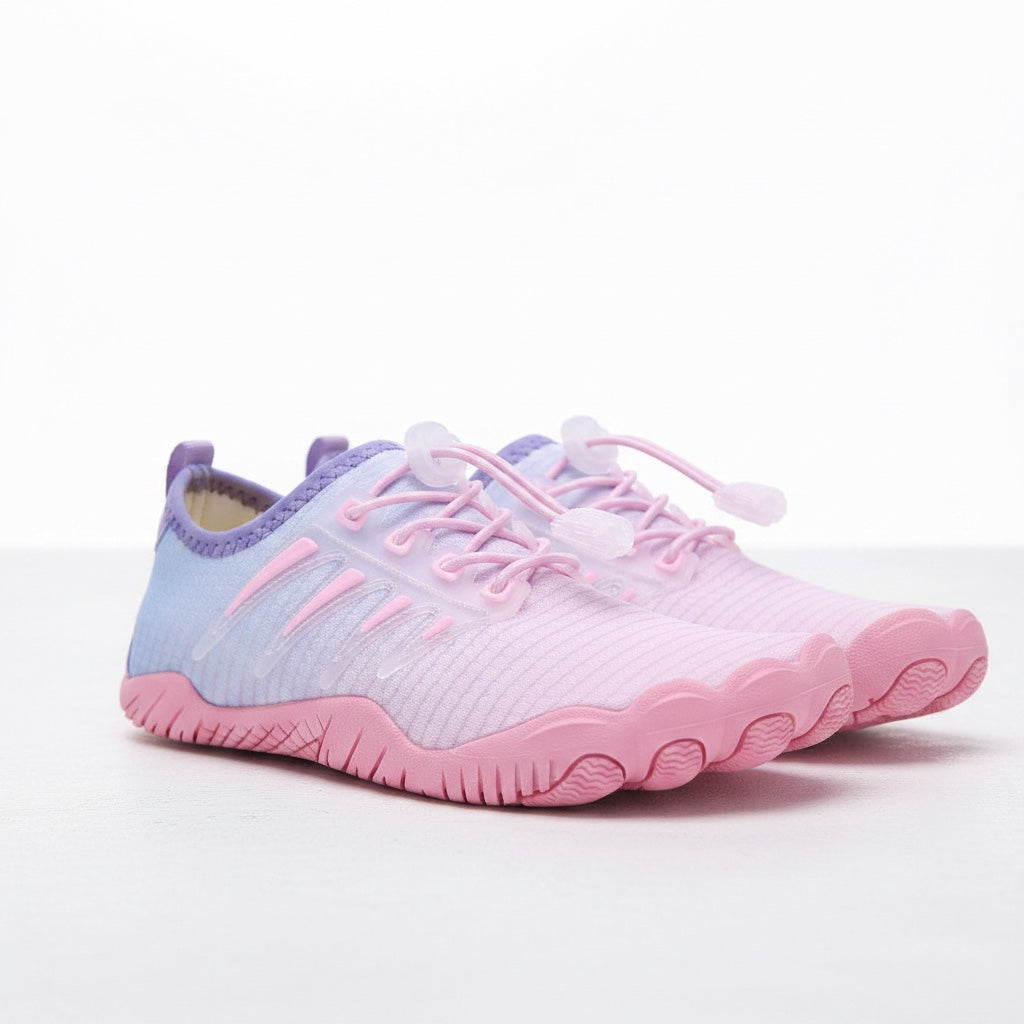 Pair of pink barefoot water shoes shown from an angled side view