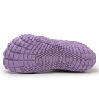 Purple textured shoe sole on a side view.