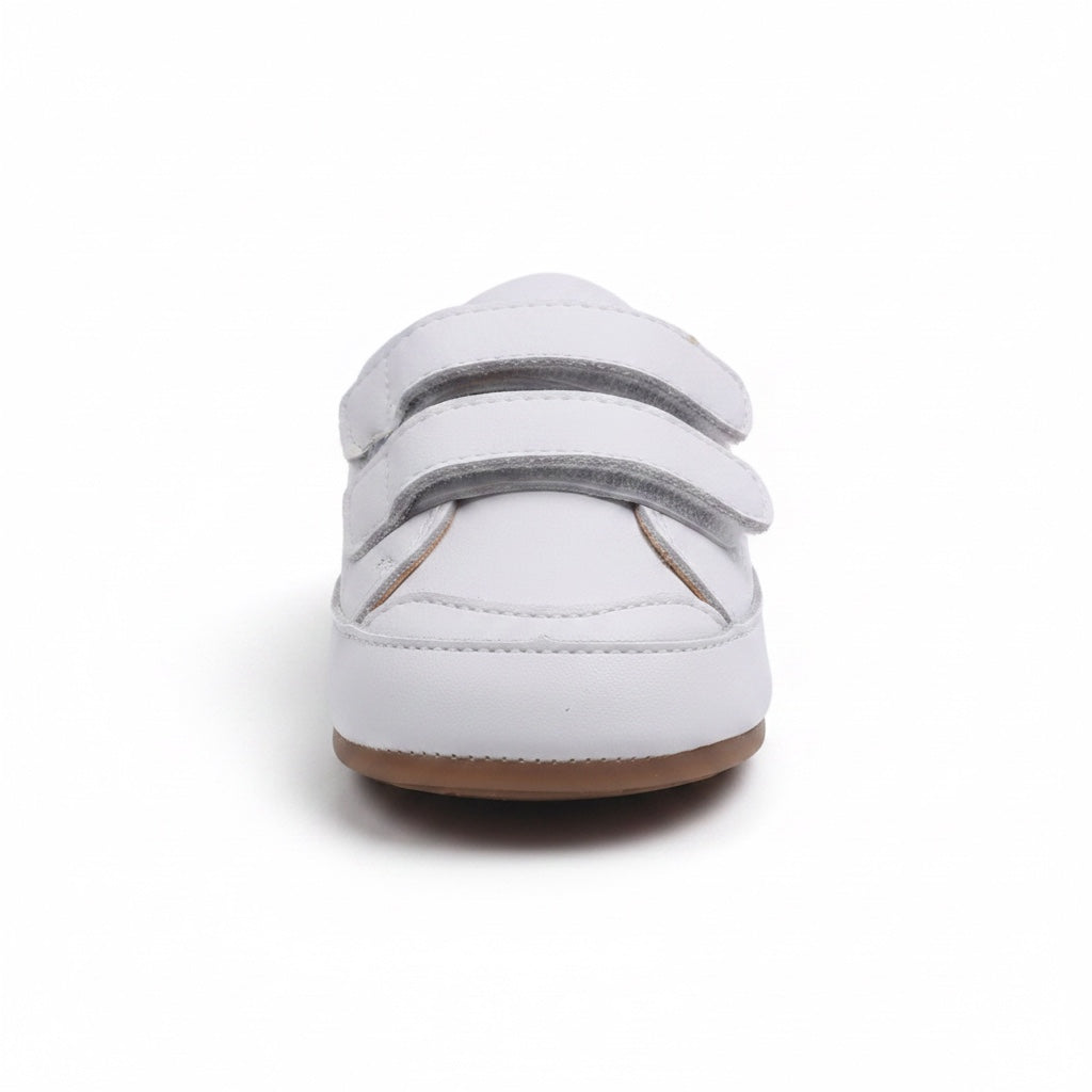 Front view of white baby shoes with two adjustable hook and loop straps