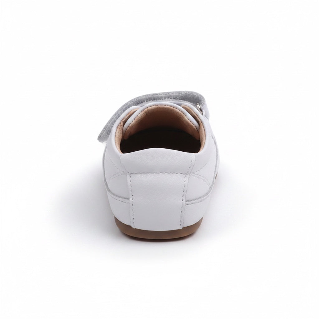 Rear view of white baby shoes showing the heel and soft brown sole