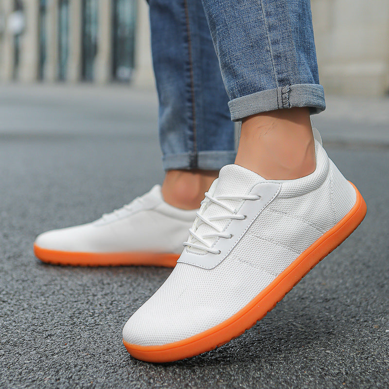 White knit barefoot shoe worn by a model
