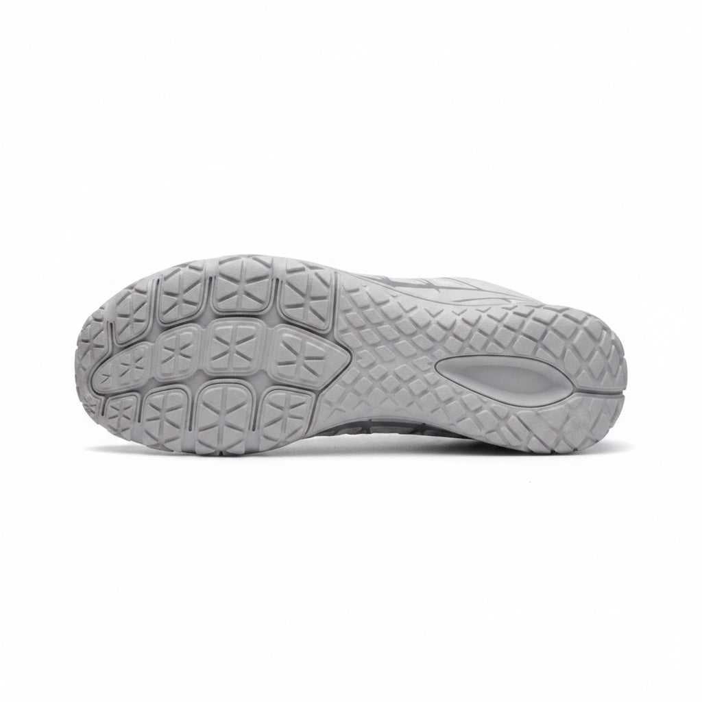 Bottom view showing the textured outsole designed for flexibility, grip and natural movement.