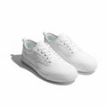 A pair of white low top canvas Barefoot Shoes  with white laces and white rubber soles.