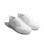 A pair of white low top canvas Barefoot Shoes  with white laces and white rubber soles.