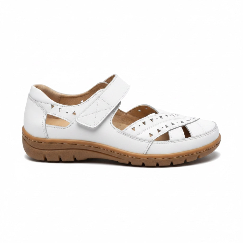 White women's comfort sandal with adjustable strap, cutout design, and cushioned brown sole