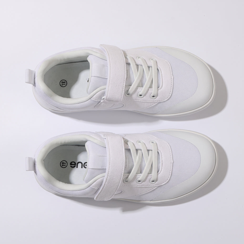 A pair of white barefoot children's shoes with white laces and rubber