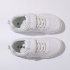 A pair of white barefoot children's shoes with white laces and rubber