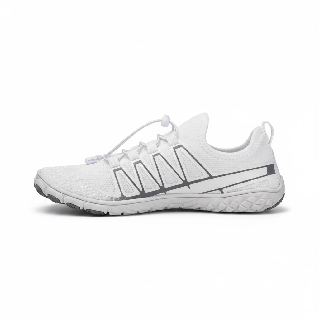 Detailed side view highlighting the minimalist design and flexible outsole of the white barefoot shoe.