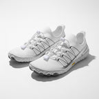 Pair of white unisex barefoot shoes showing the minimalist shape and flexible sole design.
