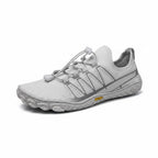 Angled side view showing the breathable upper, wide toe box and flexible outsole.