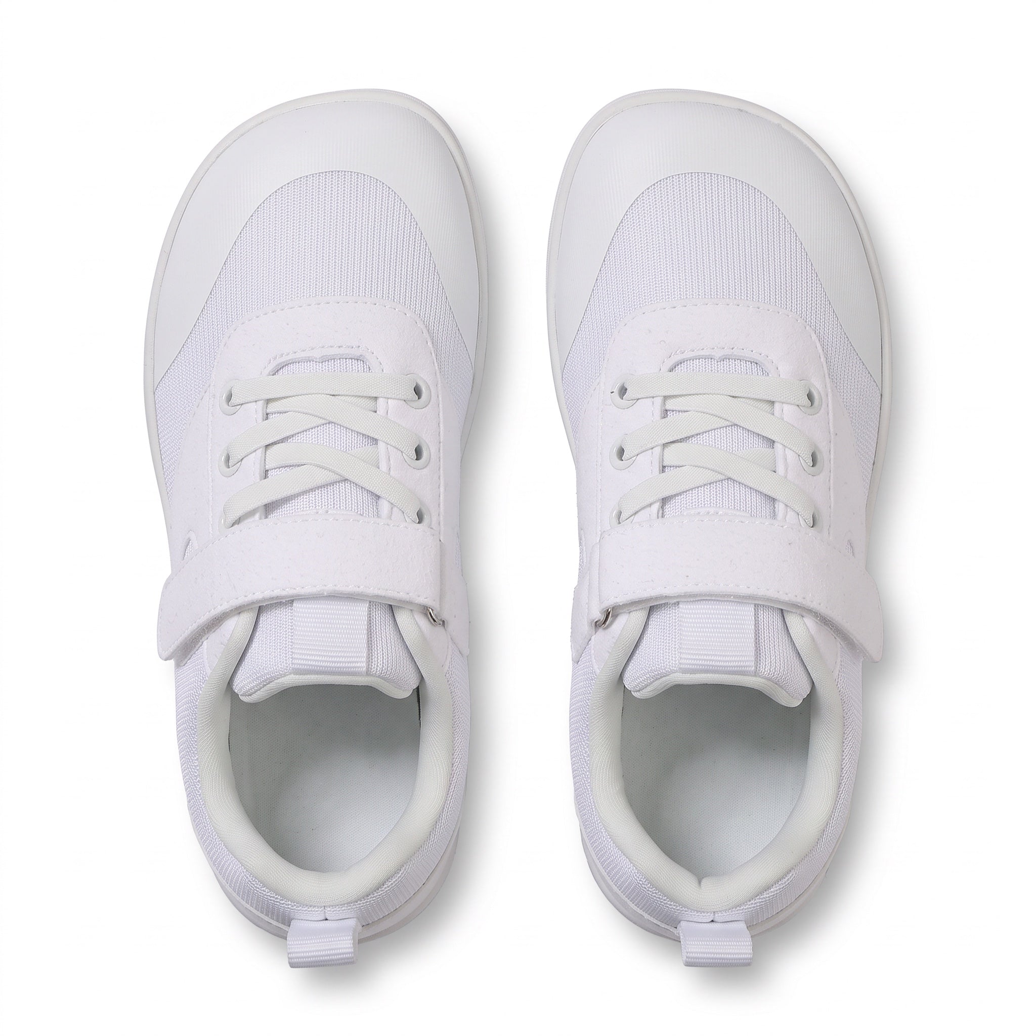 A pair of white children's  barefoot shoes shown from a top down view.