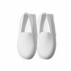 A pair of white slip on Loafers shoes with a textured, honeycomb like knit upper, shown from a top down perspective.